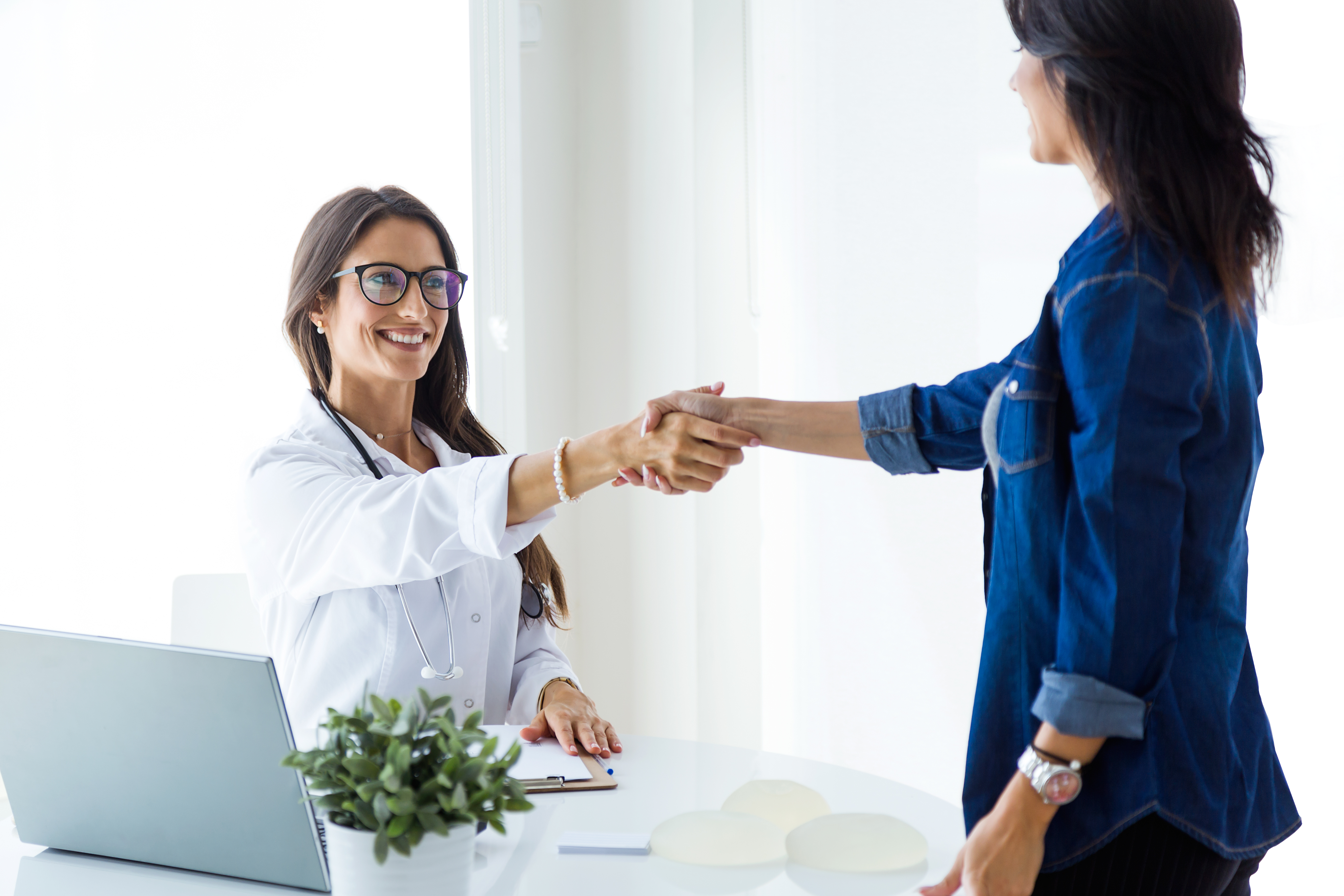 Doctor shaking hands with patient